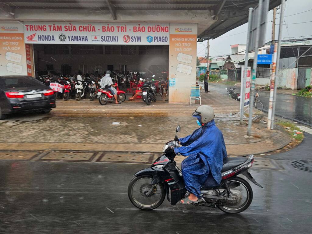Raining street in Vietnam with scooter