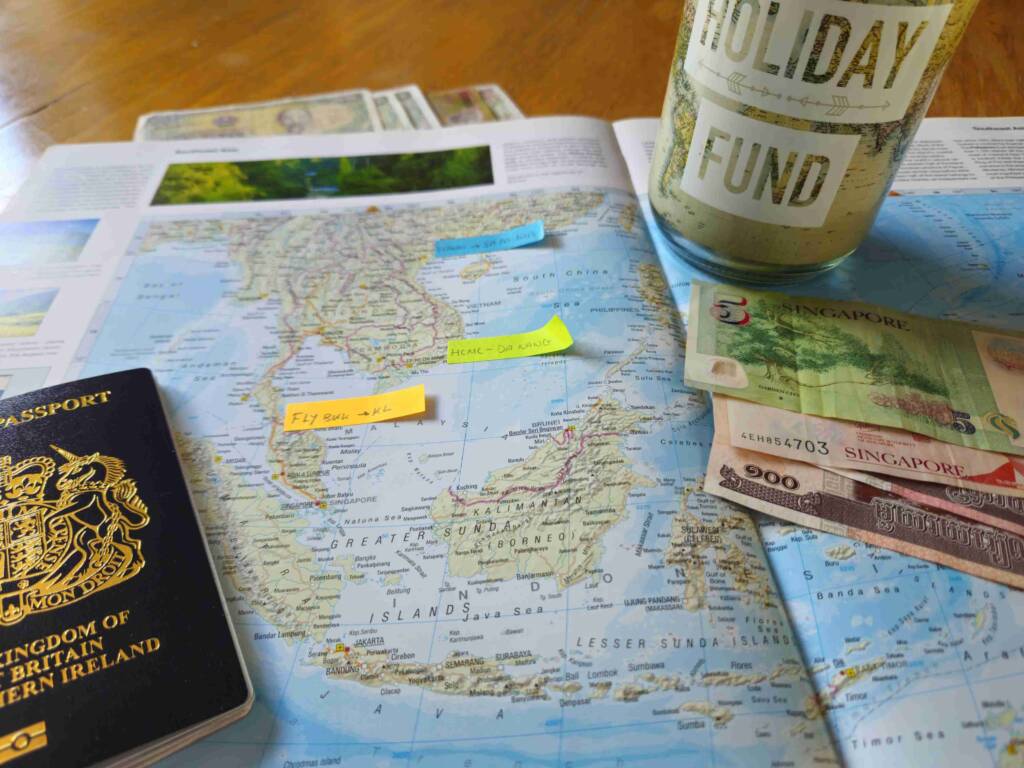 planning Southeast Asia travel on a budget with travel money, holiday fund and passport