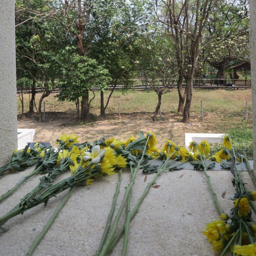 flowers laid at Choeung Ek memorial stupa remembering the Cambodian Killing Fields.