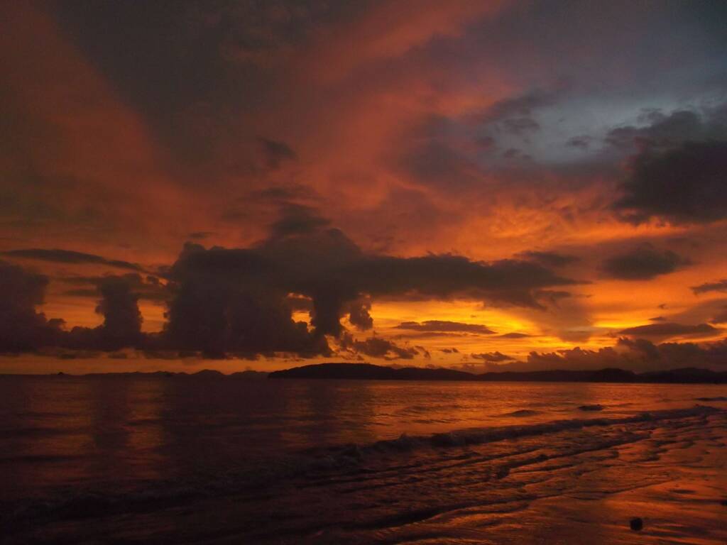 Gorgeous sunset over the Andaman Sea on Koh Lanta, Thailand, ideal for relaxing during a 6 month Southeast Asia backpacking itinerary.