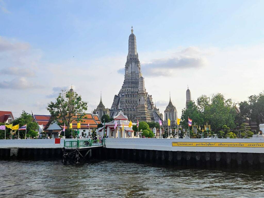 The iconic central spire of Wat Arun Temple in Bangkok, Thailand, the first stop on this 6 month itinerary