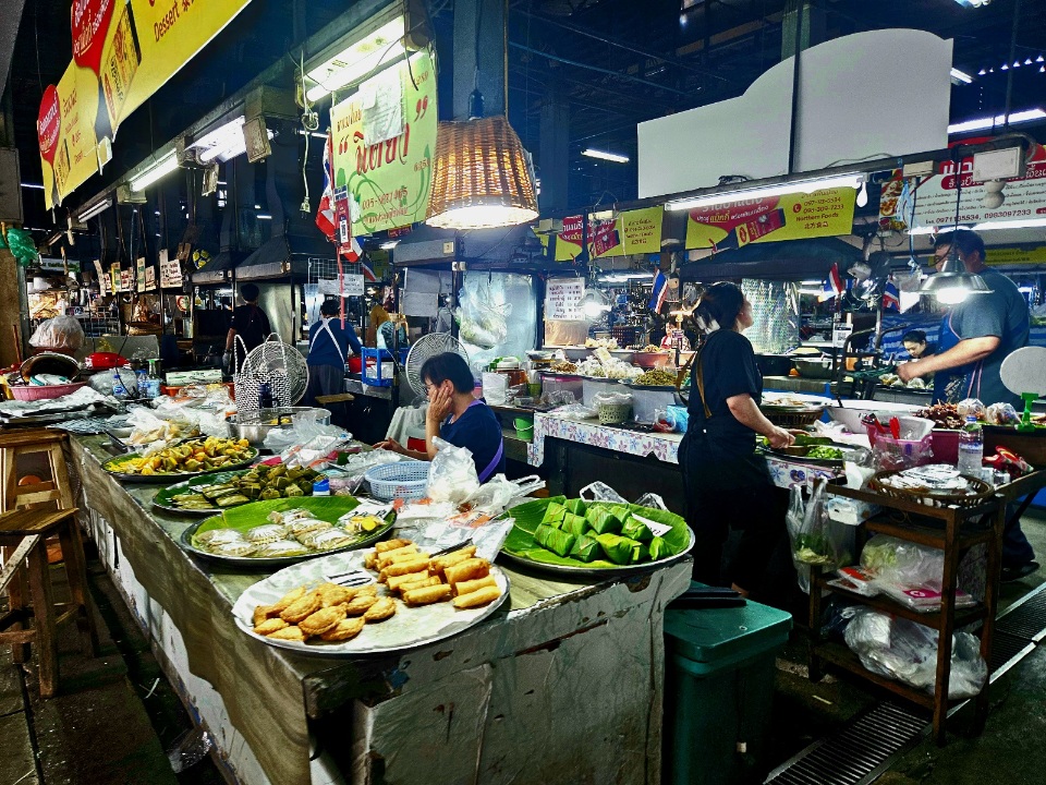 Busy market stall with Thai food in Bangkok